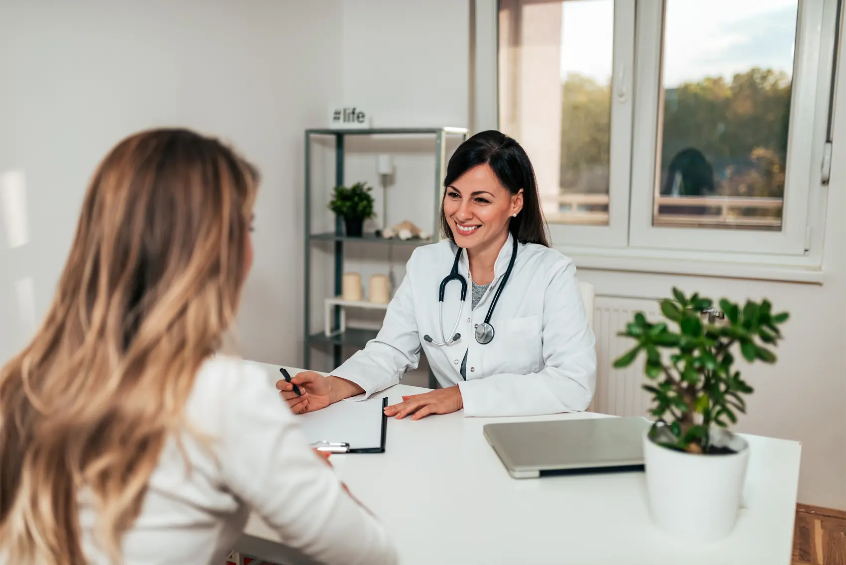 A Care4All physician in a warm consultation with a patient